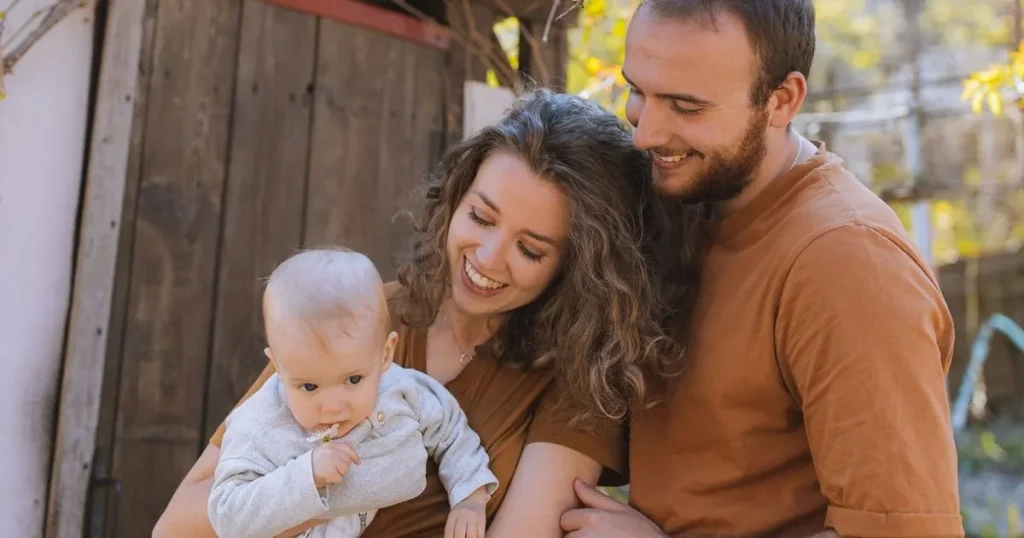 Happy family enjoying time together after building a strong relationship through gentle parenting.