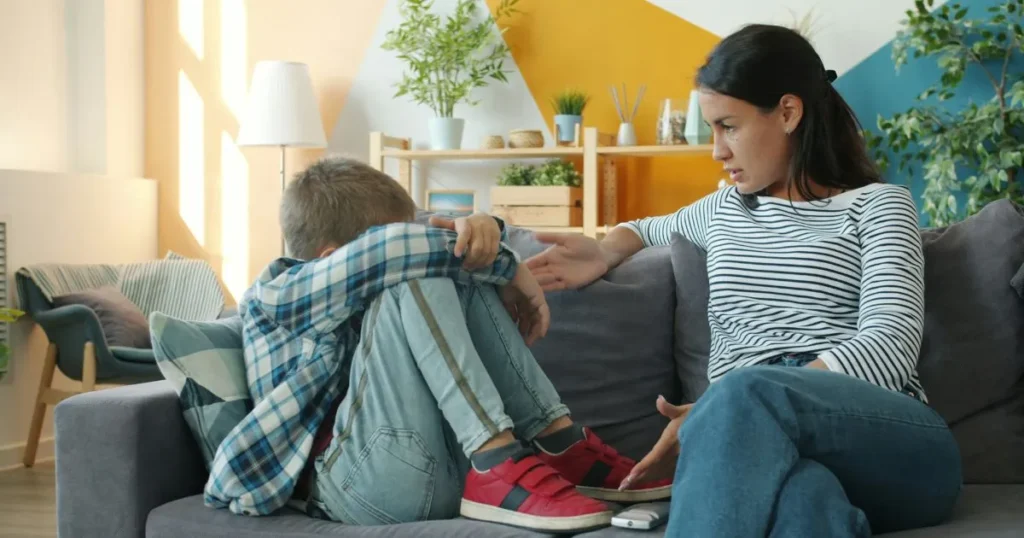 Parent calmly supporting a child during a tantrum by offering reassurance and simple choices instead of punishment.