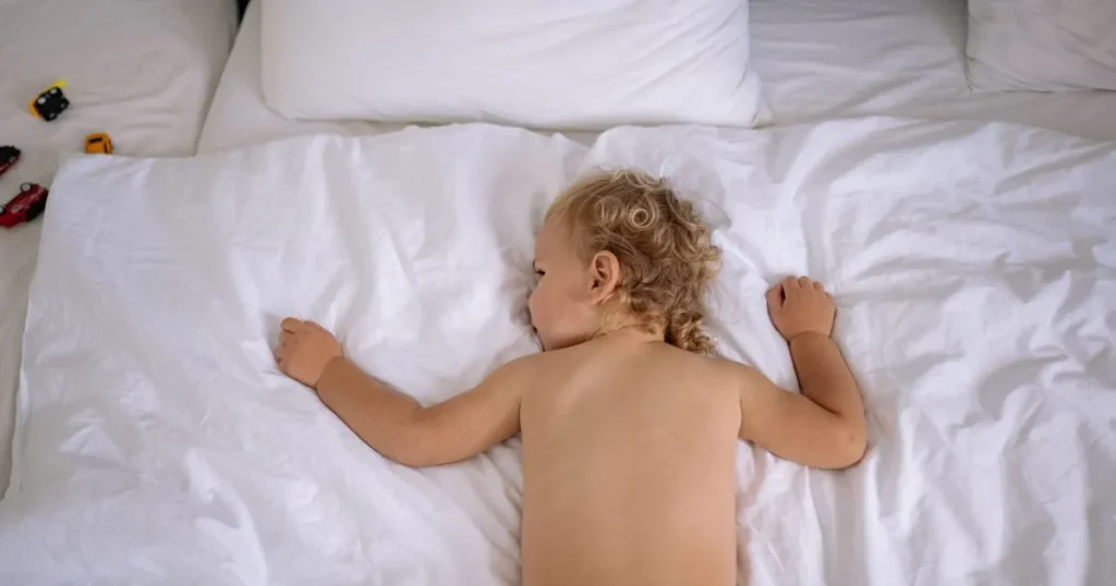 Toddler experiencing separation anxiety at bedtime during the 18 month sleep regression.
