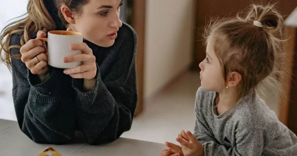 Authoritative parent calmly talking with their child