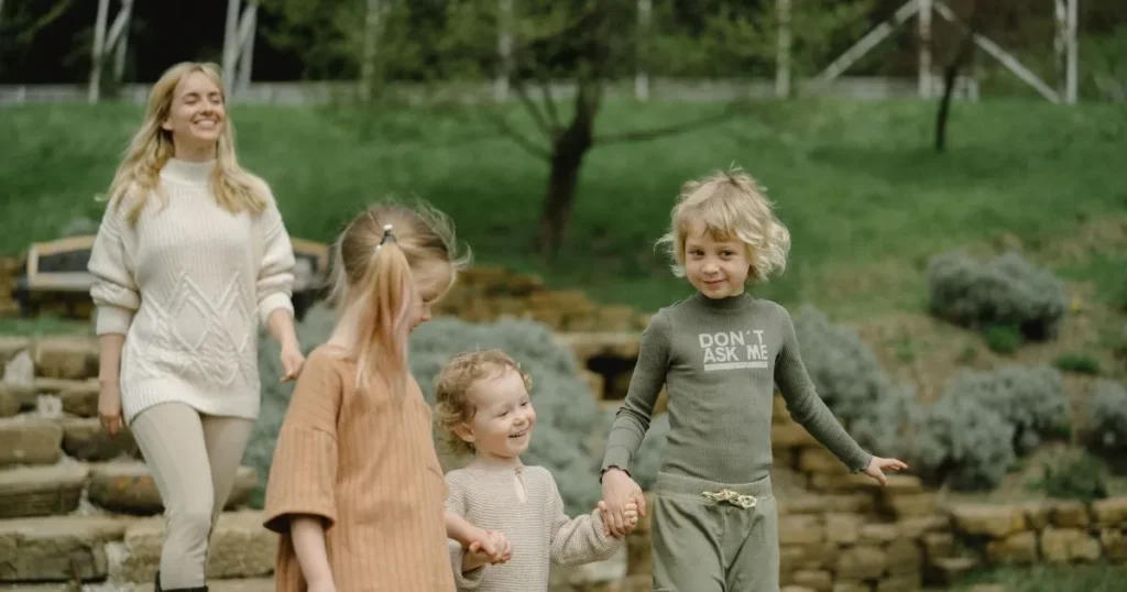 Relaxed mother enjoying quality time with her children outdoors