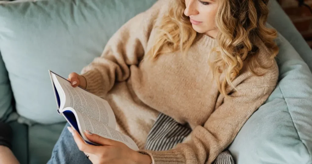 Mom relaxing with book after the kids are asleep