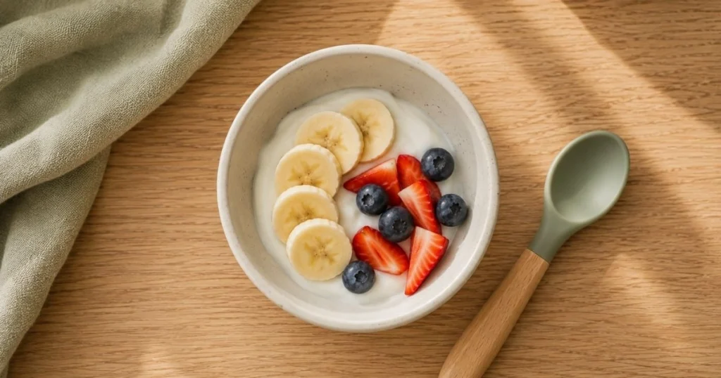 Greek yogurt with soft fruit for toddler breakfast