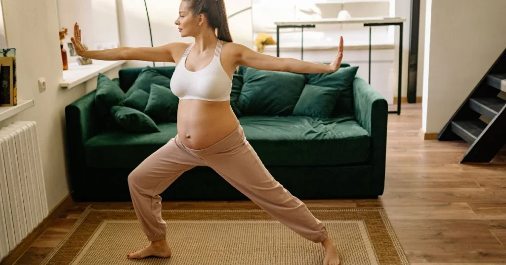 How to Stay Active During Your Pregnancy: Safe and Fun Ways to Keep Moving 6 Pregnant woman doing gentle movement at home during pregnancy