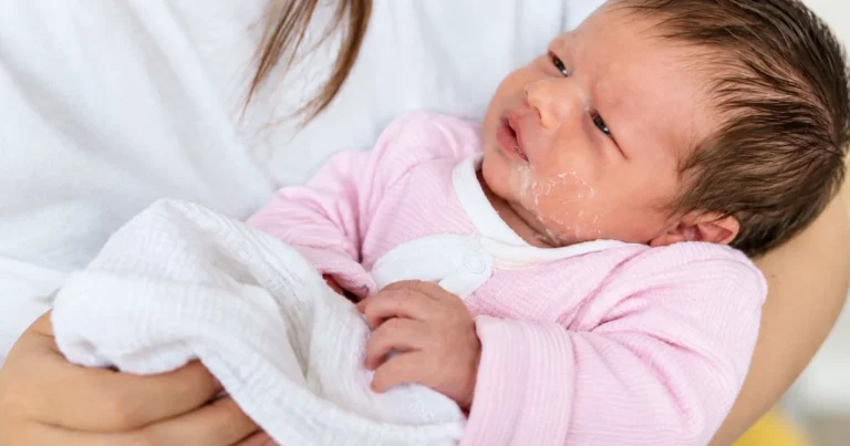 newborn baby vomiting milk after feeding