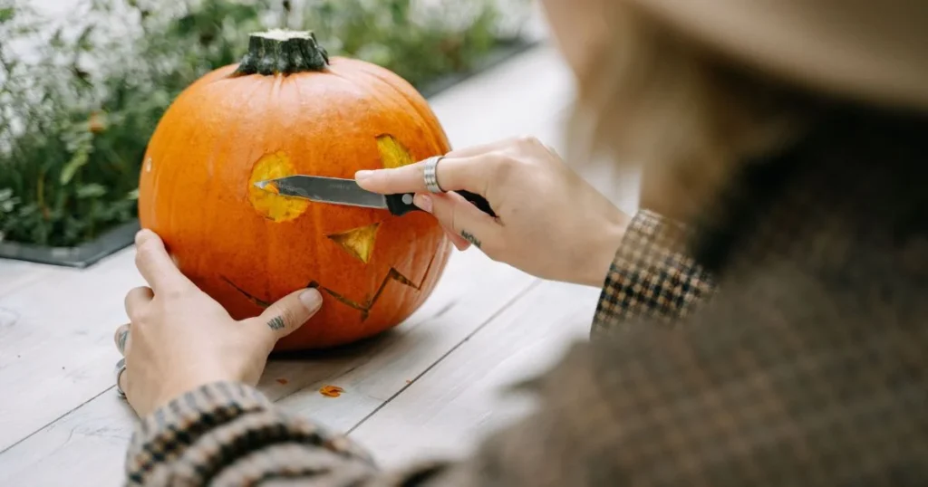 Halloween Activities for Kids: 20 Easy Ideas at Home 6 family enjoying Halloween activities for kids at home with crafts and pumpkins