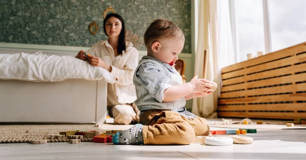 Why Kids Are Rebelling and How to Respond Calmly 6 Mother calmly acknowledging her toddler’s feelings while maintaining a boundary