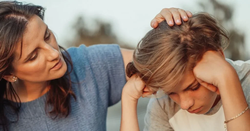 Encouragement for Kids: How to Support Without Pressure or Praise 6 Parent calmly supporting frustrated child without pressure